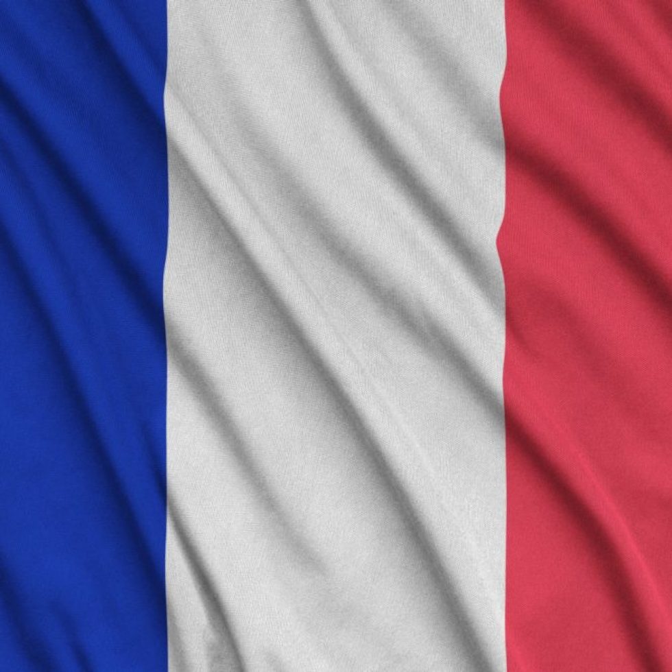 France flag is depicted on a sports cloth fabric with many folds. Sport team waving banner