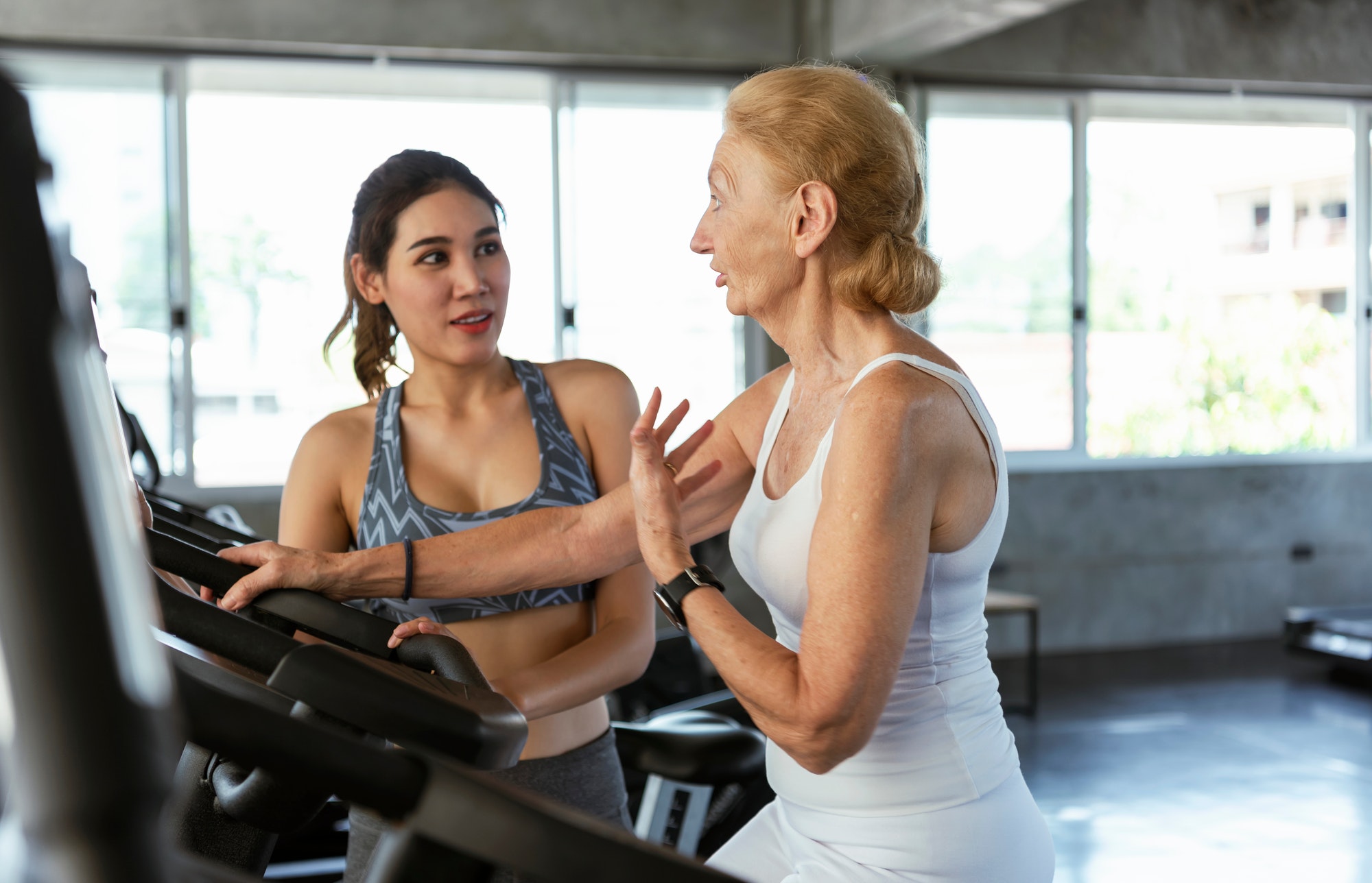 Healthcare: Physio therapy sports trainer with her client in fitness.