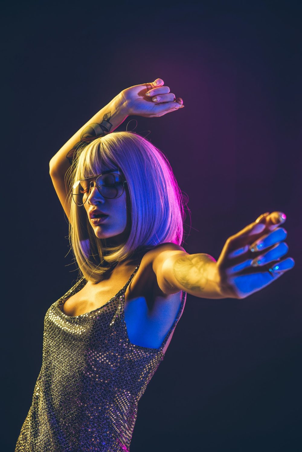 Young woman with grey hair dancing and celebrate