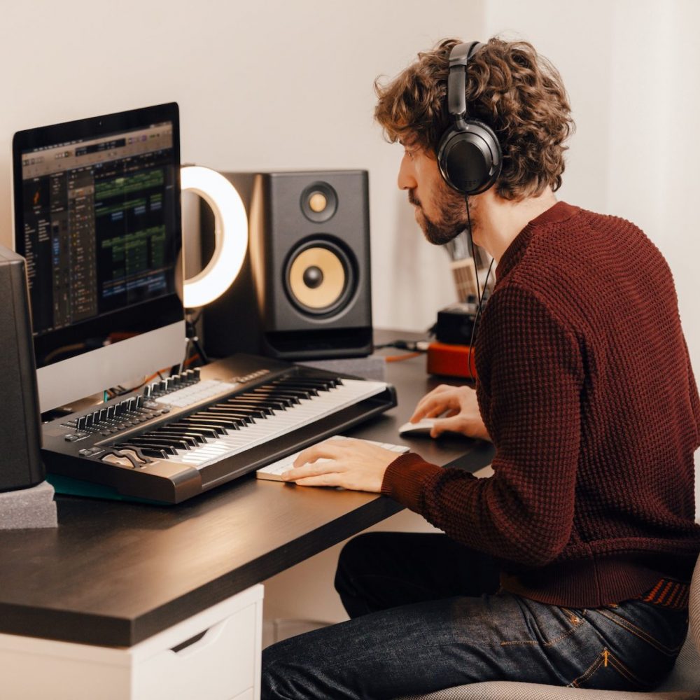 Music producer working at home music studio
