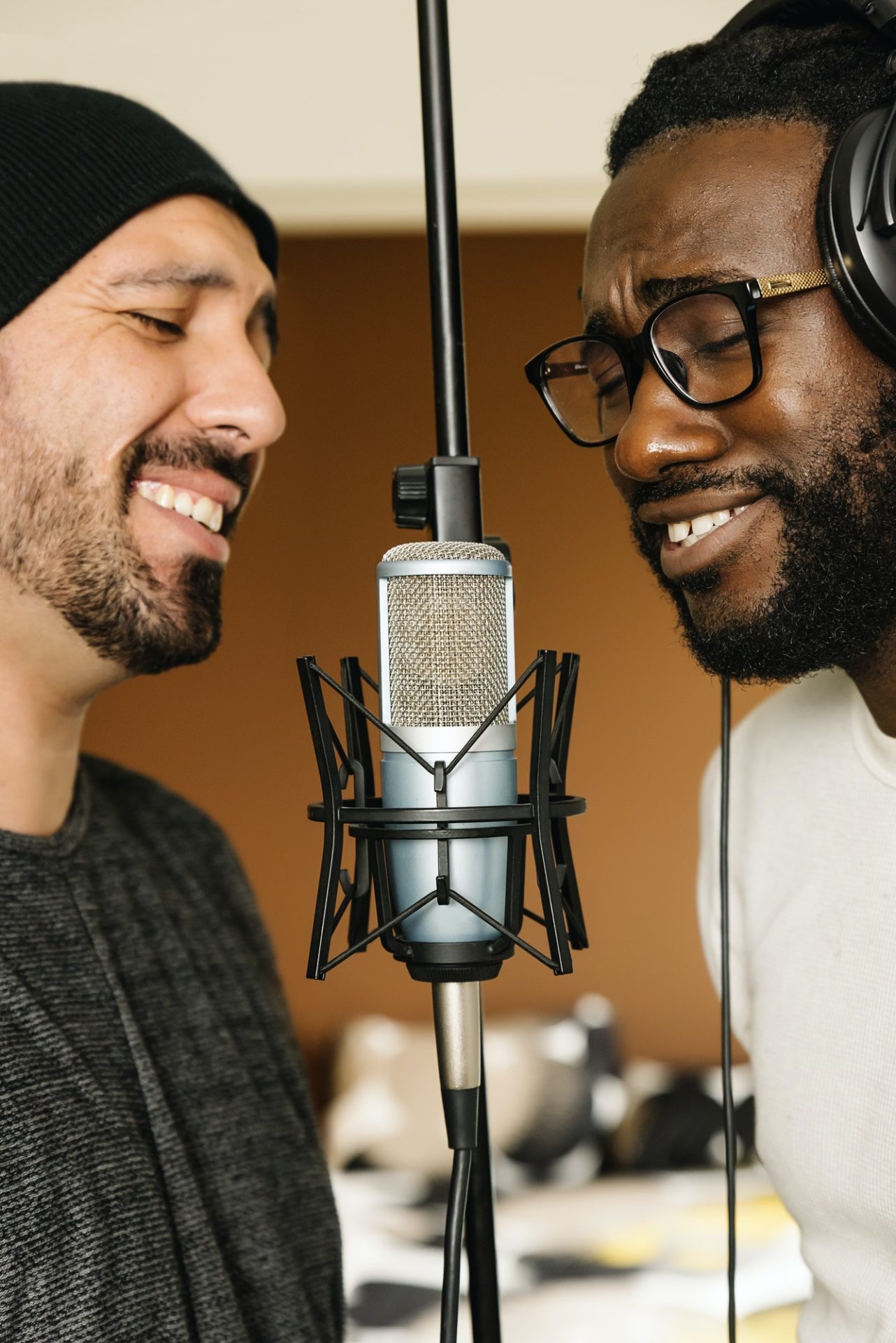 Multiracial artists singing on studio.