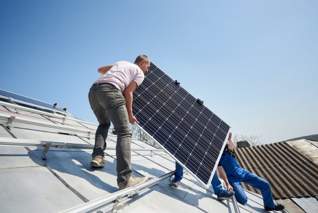 Installing solar photovoltaic panel system on roof of house