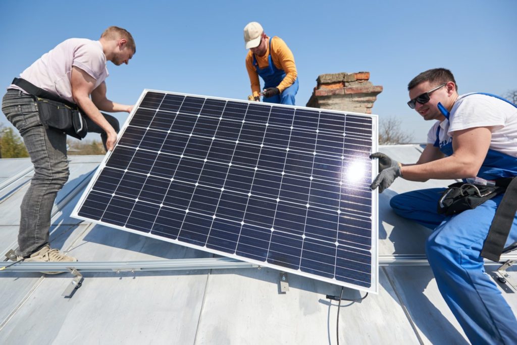 Installing solar photovoltaic panel system on roof of house