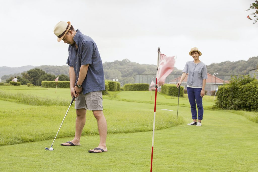 Couple on a golf course.