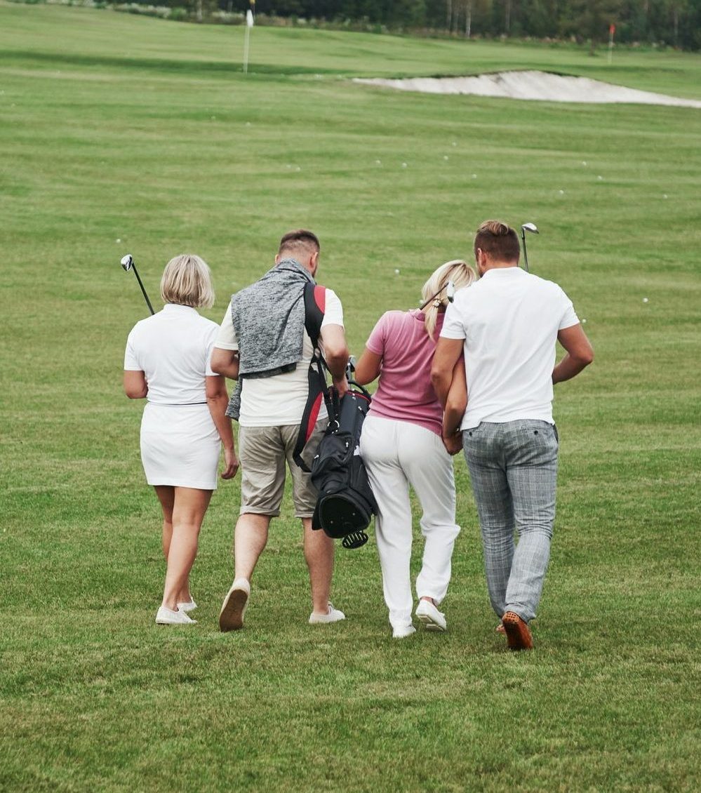 Group of stylish friends on the golf course learn to play a new game