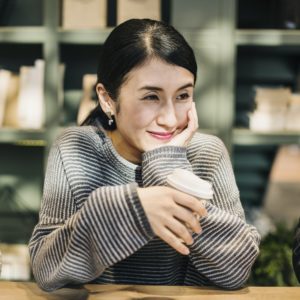 Japanese woman having a coffee
