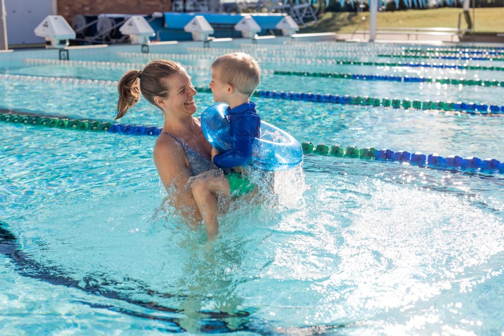 Mother and child in swimming pool