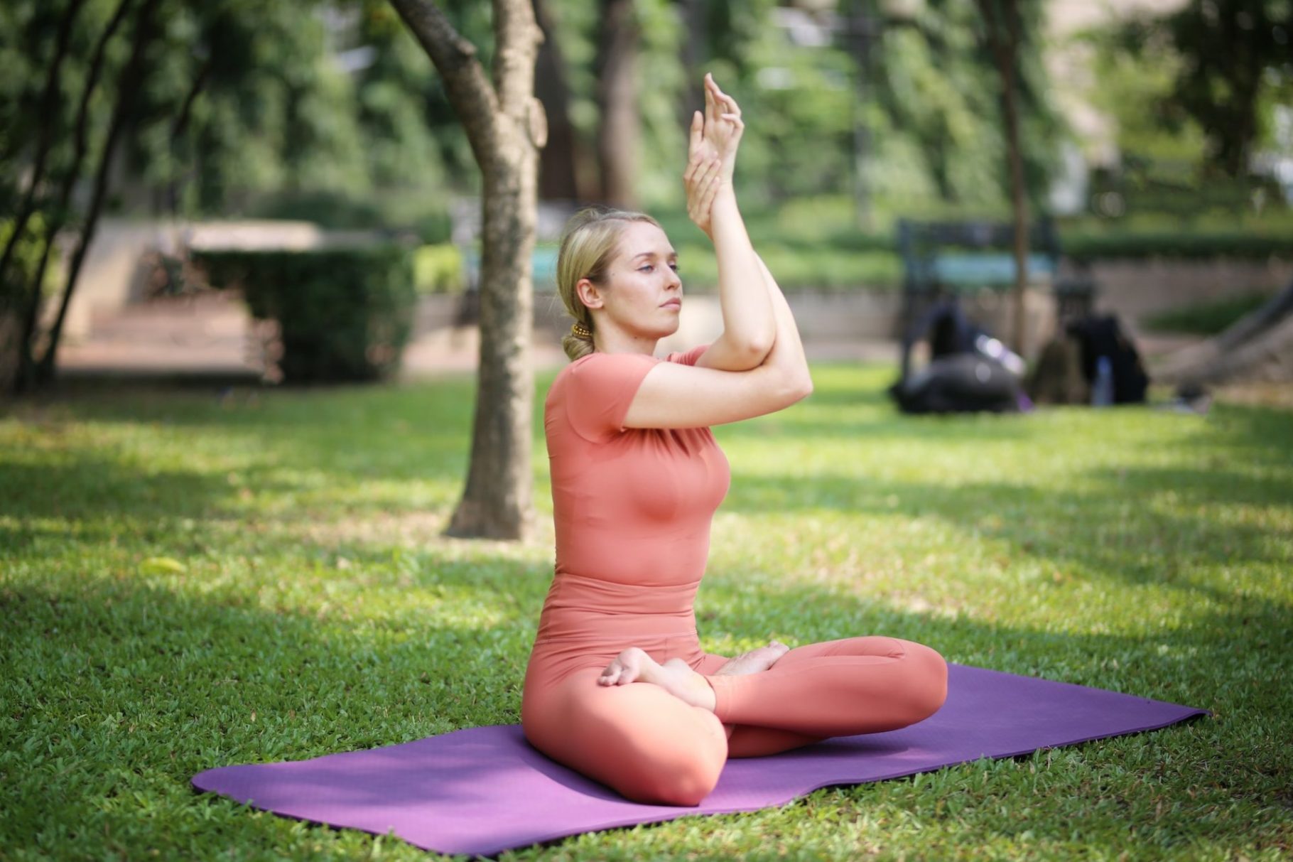 Portrait of attractive blonde hair young woman exercise yoga outdoor.