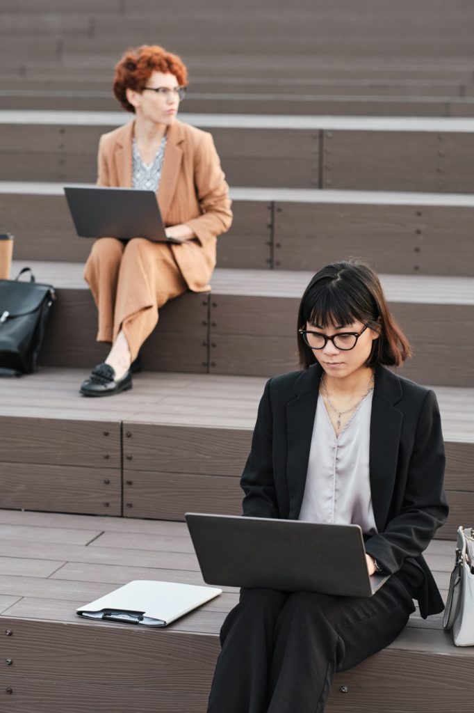 Female Office Workers With Laptops